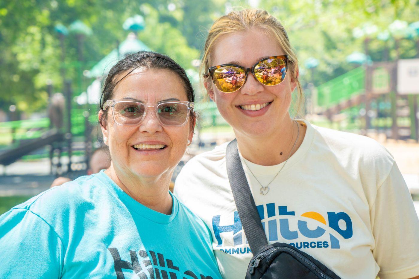 Two women smiling into camera